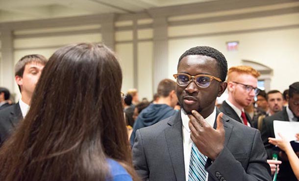 Students and employers talk at a networking event